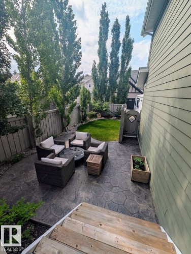 Expansive stamped concrete patio with direct backyard access from wood stairs - 2327 Frezenberg Avenue, Edmonton, AB 