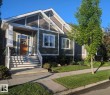 Craftsman-style exterior featuring a deep olive siding and complementary shingle accents - 2327 Frezenberg Avenue, Edmonton, AB 