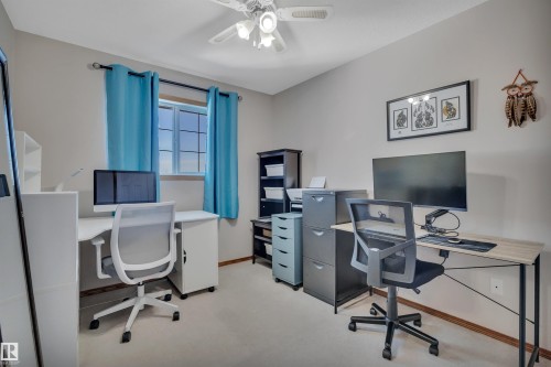Room featuring light-colored walls and carpet flooring - 207-4807 43A Ave, Leduc, AB 