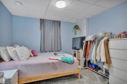 Light blue wall paint and grid-pattern acoustic ceiling tiles - 
