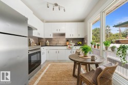 Virtually staged kitchen to help potential buyers envision it as a warm, functional space ready for daily life. - 