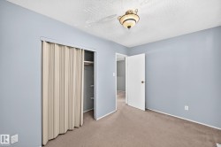 Interior room with light blue painted walls and neutral carpeting - 