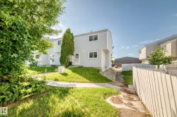 Light gray siding exterior with multiple windows - 