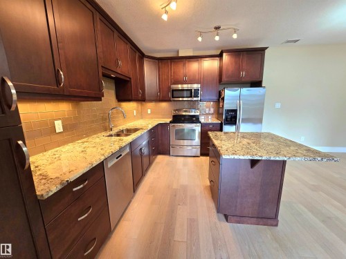 256 6079 Maynard Way, Edmonton, AB - Indoor Photo Showing Kitchen With Stainless Steel Kitchen With Upgraded Kitchen