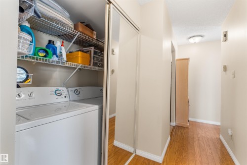 Dedicated laundry closet with wire shelving - 2324 151 Avenue Nw, Edmonton, AB 