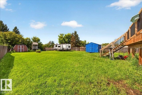 Expansive green lawn providing ample outdoor space - 5215 50 Avenue, Bruderheim, AB - Outdoor