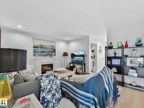 157 Garneau Gate, Spruce Grove, AB - Indoor Photo Showing Living Room With Fireplace