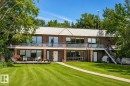Brick exterior with multiple levels of outdoor living space - 60528 Range Road 112, Rural St. Paul County, AB 