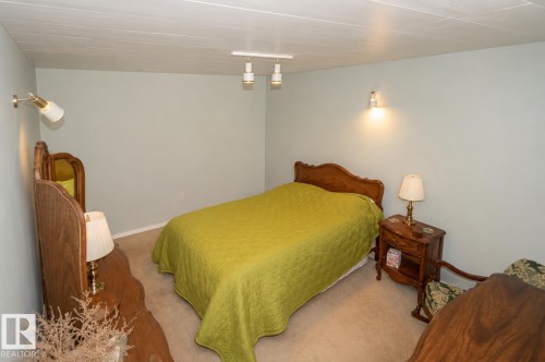 Neutral-toned walls complement the textured ceiling - 60528 Range Road 112, Rural St. Paul County, AB 