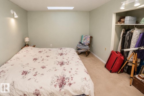 Recessed ceiling light fixture, wall-mounted spotlight, and track lighting illuminating the space - 60528 Range Road 112, Rural St. Paul County, AB 