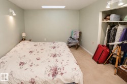 Recessed ceiling light fixture, wall-mounted spotlight, and track lighting illuminating the space - 