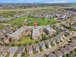 Large multi-story residential building featuring brick exterior construction and multiple private balconies - 