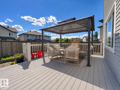 Expansive composite deck featuring a white railing system and a built-in gazebo - 526 173A Street, Edmonton, AB 