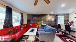 Open concept living area featuring recessed lighting and a ceiling fan - 