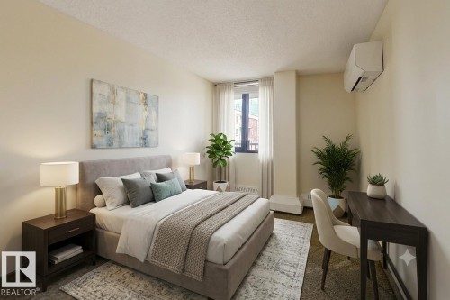 Bedroom featuring soft cream walls and a textured ceiling - 505 10145 109 Street, Edmonton, AB 