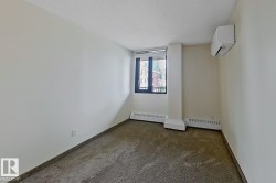 Bright room featuring neutral-toned carpet flooring and white painted walls - 