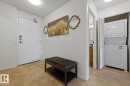 Entryway featuring a white door with a digital lock and a ceiling-mounted light fixture - 505 10145 109 Street, Edmonton, AB 