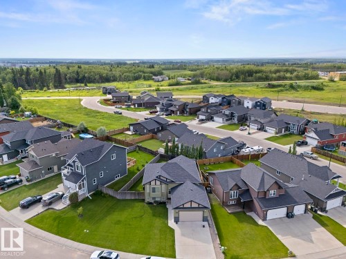 Residential neighborhood featuring a variety of single-family homes, landscaped yards, and concrete driveways - 35 Falcon Road, Cold Lake, AB 