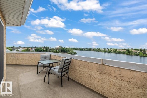 Expansive private balcony with textured stucco walls and a smooth concrete floor - 427 15499 Castle Downs Road, Edmonton, AB 