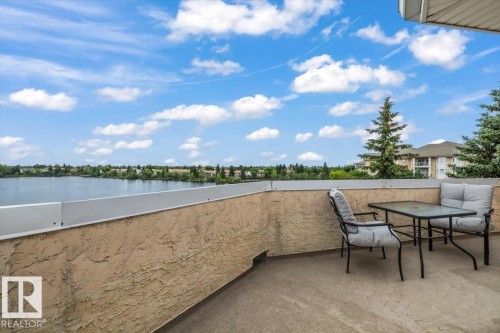 Spacious outdoor balcony with stucco texture wall and concrete flooring - 427 15499 Castle Downs Road, Edmonton, AB 