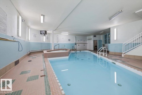 Indoor swimming pool featuring a tiled surround and a connected spa - 427 15499 Castle Downs Road, Edmonton, AB 