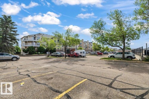 Multi-story building featuring balconies and a surrounding parking area - 427 15499 Castle Downs Road, Edmonton, AB 