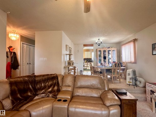 Living area featuring light-toned walls and carpet flooring - 10619 108 Avenue, Westlock, AB - Indoor Photo Showing Living Room