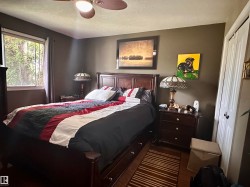 Dark wood-finish flooring with a multi-paned window - 