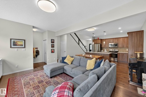Open-concept living space featuring wood-finish flooring throughout - 2007 72 Street, Edmonton, AB - Indoor Photo Showing Living Room