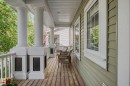 Expansive covered porch featuring substantial white architectural columns, a light wood-finish floor, and a shingle-sided exterior with white-framed windows - 2007 72 Street, Edmonton, AB  - Outdoor With Deck Patio Veranda With Exterior 