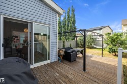 Wooden deck with sliding glass door access - 