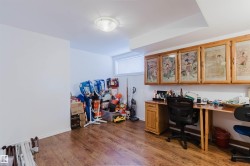 Spacious room featuring wood-finish flooring, a flush-mount ceiling light, and a horizontal window - 