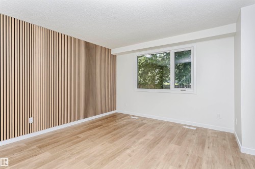 Accent wall featuring vertical wood slat detailing - 5418 144B Avenue, Edmonton, AB 