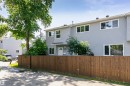 Two-story residential structure featuring light gray siding and white trim - 5418 144B Avenue, Edmonton, AB 