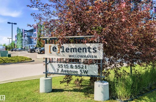 Modern apartment complex with a contemporary sign, mature landscaping, paved parking area, and multi-story buildings - 435 5515 7 Avenue, Edmonton, AB 