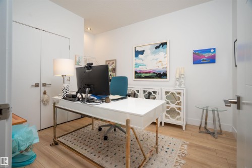Light wood-finish flooring complements the bright white walls and recessed lighting - 4714 Charles Bay Bay, Edmonton, AB 