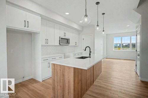 400 Stiles Way, Leduc, AB - Indoor Photo Showing Kitchen With Upgraded Kitchen