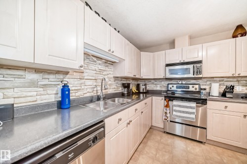 220 4312 139 Avenue, Edmonton, AB - Indoor Photo Showing Kitchen With Stainless Steel Kitchen With Double Sink