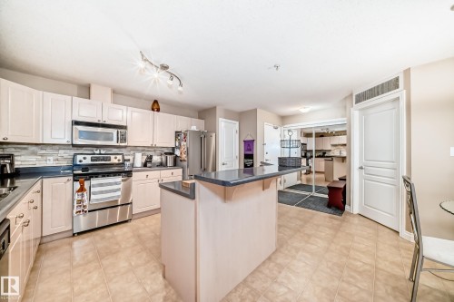 220 4312 139 Avenue, Edmonton, AB - Indoor Photo Showing Kitchen With Stainless Steel Kitchen With Double Sink