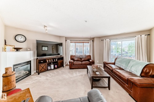 220 4312 139 Avenue, Edmonton, AB - Indoor Photo Showing Living Room With Fireplace