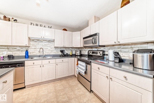 220 4312 139 Avenue, Edmonton, AB - Indoor Photo Showing Kitchen With Stainless Steel Kitchen With Double Sink