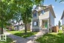 Two-story residence featuring light beige siding and dark trim - 21320 90 Avenue, Edmonton, AB 