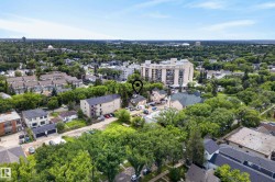 Aerial perspective of a verdant urban landscape featuring diverse residential architecture - 