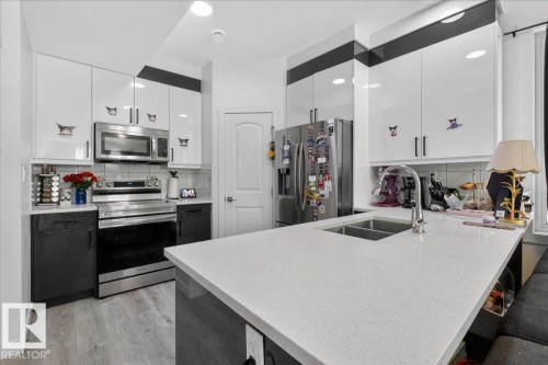 #1 11616 82 St Nw, Edmonton, AB - Indoor Photo Showing Kitchen With Double Sink With Upgraded Kitchen