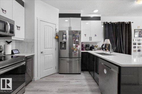 #1 11616 82 St Nw, Edmonton, AB - Indoor Photo Showing Kitchen With Double Sink With Upgraded Kitchen