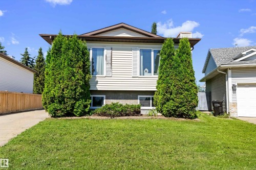 Split-level residence featuring light-colored siding and a brown-trimmed roofline - 15252 81 Street, Edmonton, AB 