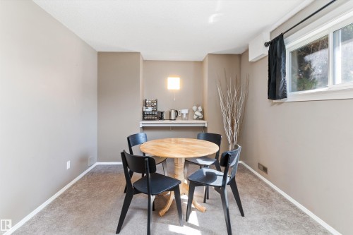 Carpeted room with neutral wall tones and white baseboards - 15252 81 Street, Edmonton, AB 