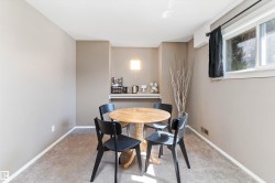 Carpeted room with neutral wall tones and white baseboards - 