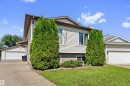 Split-level residence featuring light-colored siding and a brown roof - 15252 81 Street, Edmonton, AB 