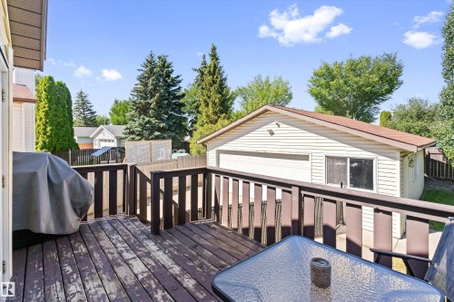 Exterior wooden deck with dark brown railing - 15252 81 Street, Edmonton, AB 